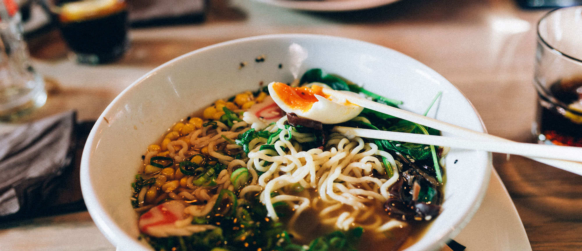 noodle soup with dashi stock served in a white bowl. 