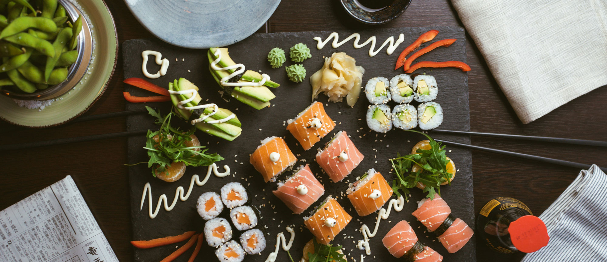 Sushi served on black tray