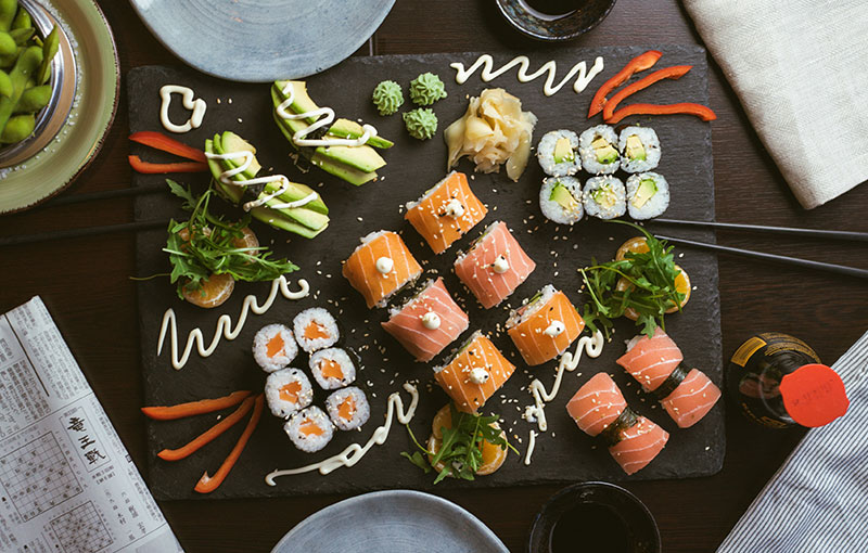 Sushi served on black tray