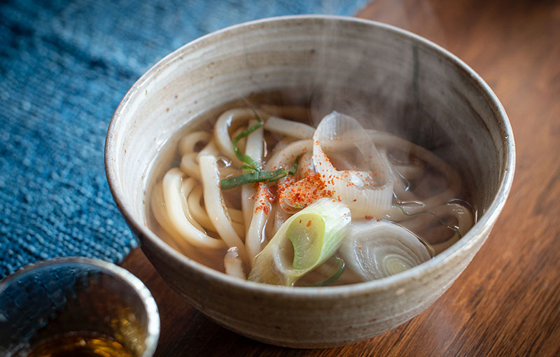 Vegan Udon Tempura soup served in a bowl.